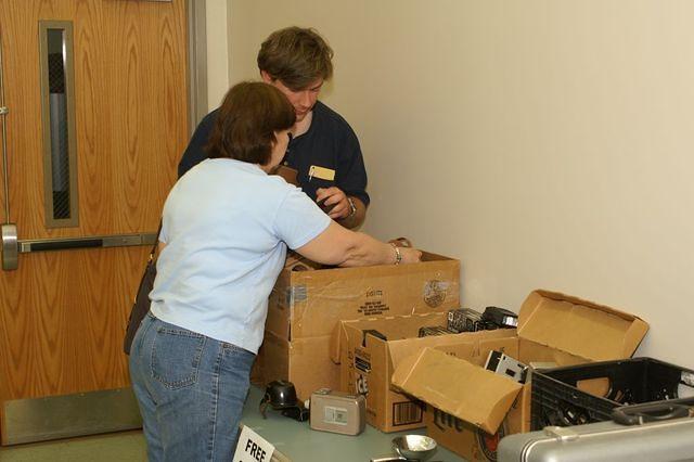 Micah and Kay digging for gold in the "Free Stuff" table.