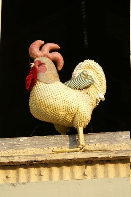A stuffed rooster stands guard